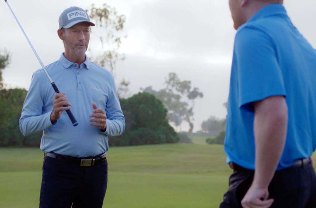 Stan Utley giving a golf lesson